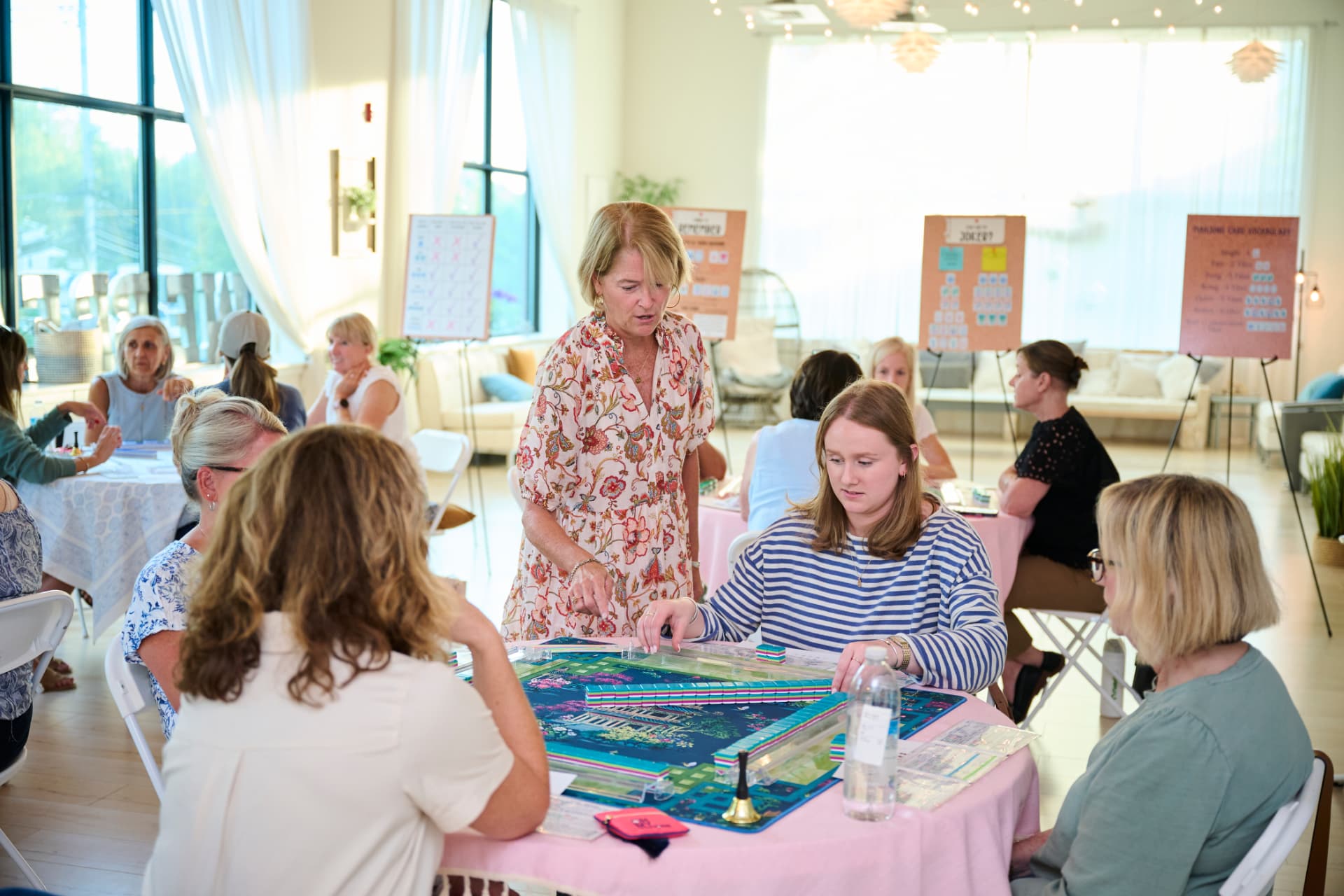 Sue leaning in to help students with their racks during a beginner class